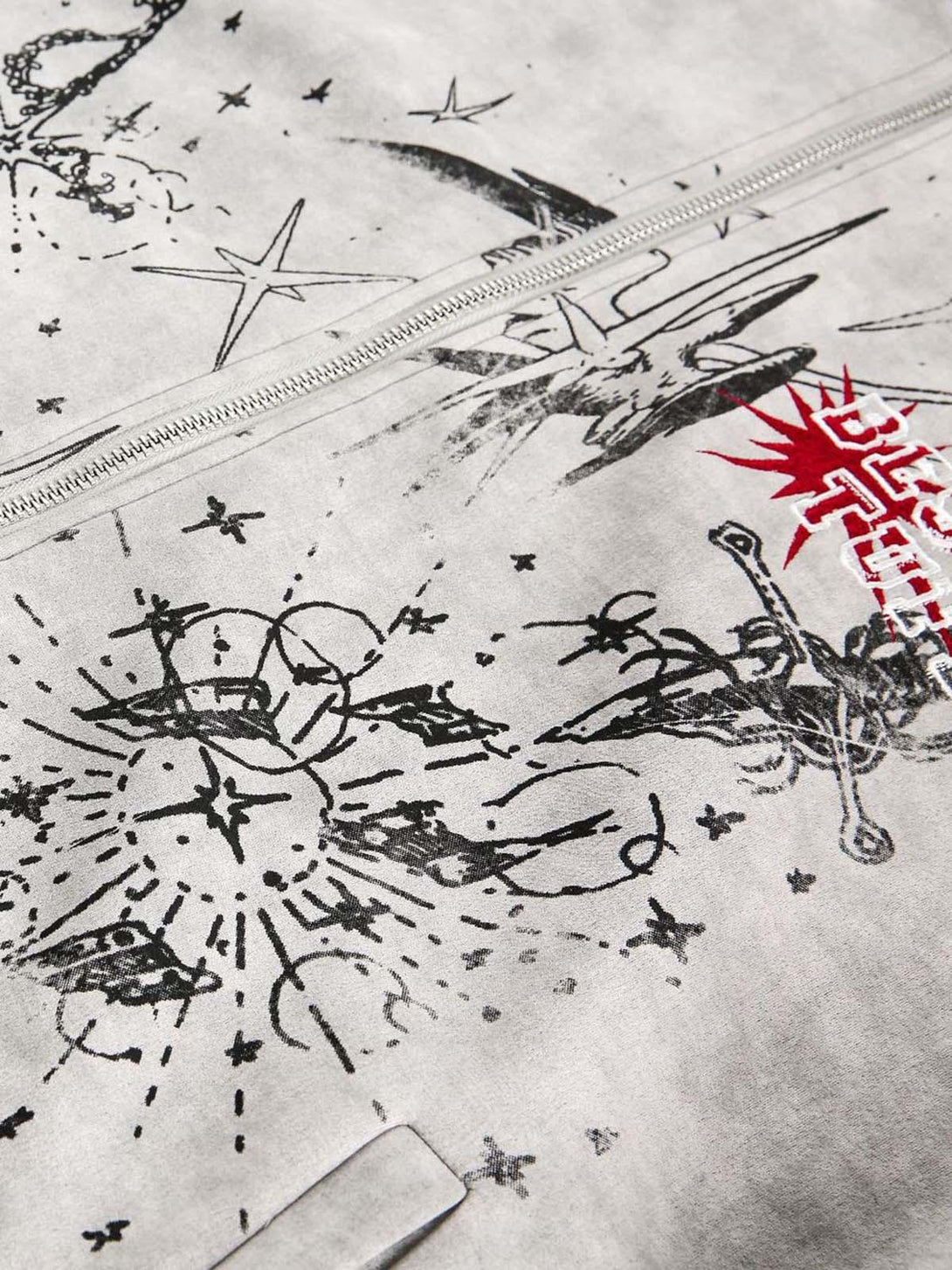Intricate look at TALISHKO's graffiti-inspired jacket, showcasing unique patterns and textures.