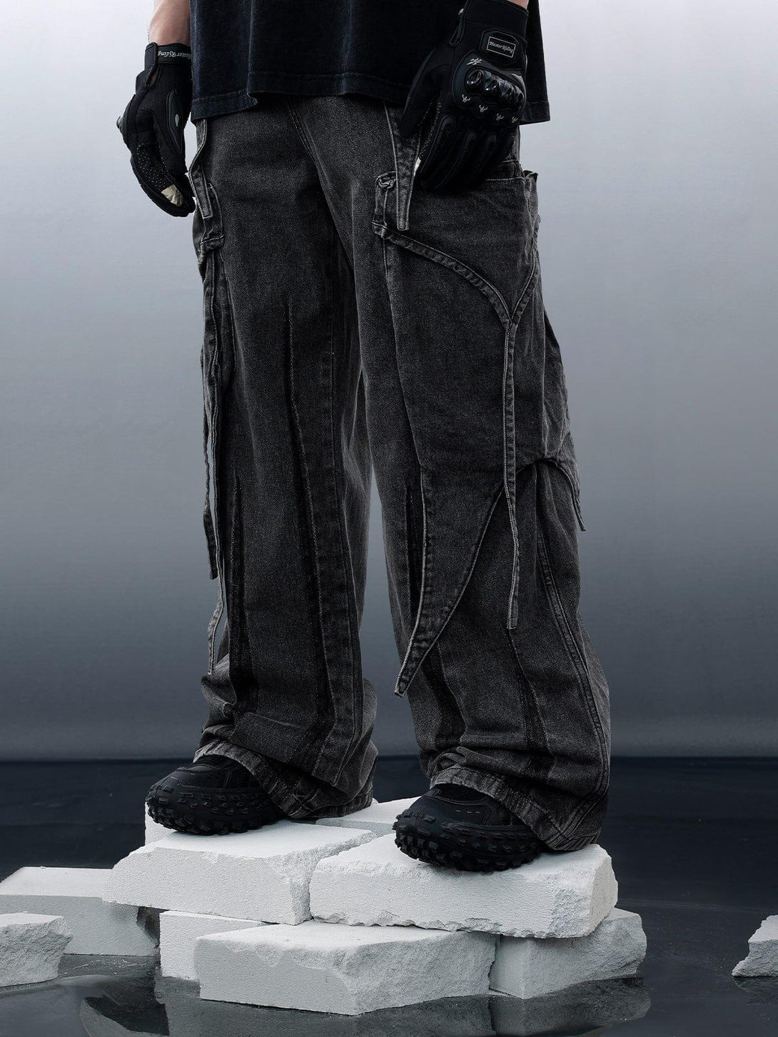TALISHKO's wasteland punk jeans, featuring washed wide legs and intricate pocket designs.
