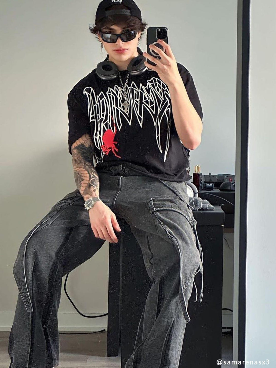 Model in TALISHKO's wasteland punk style, wearing washed wide-leg jeans with graphic tee.