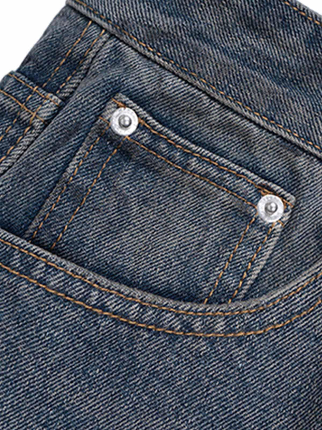 A detailed view of TALISHKO's baggy jeans pocket, showcasing intricate stitching and texture.