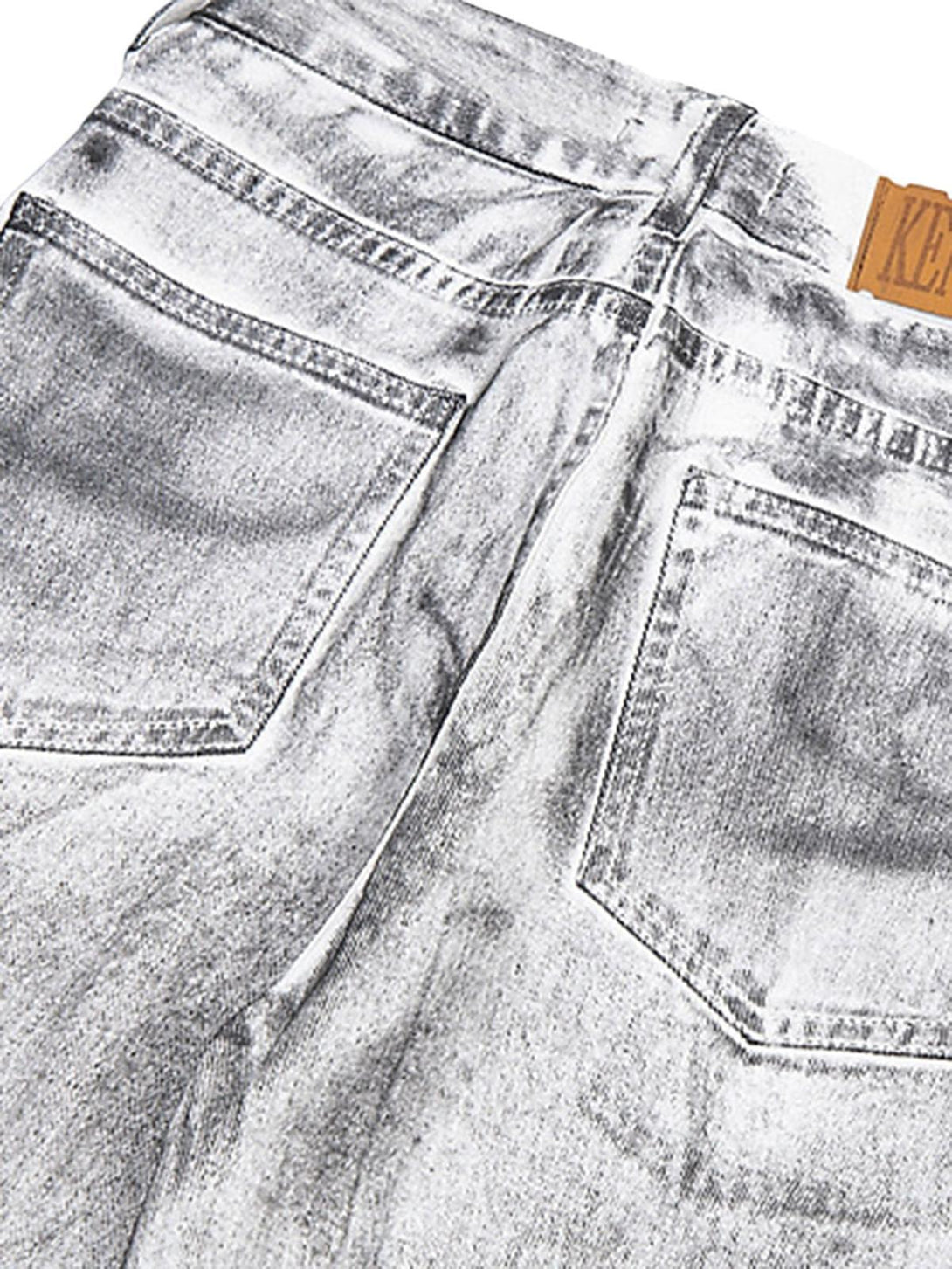 Back pocket details of TALISHKO's dirty white loose jeans, showcasing unique texture and style.