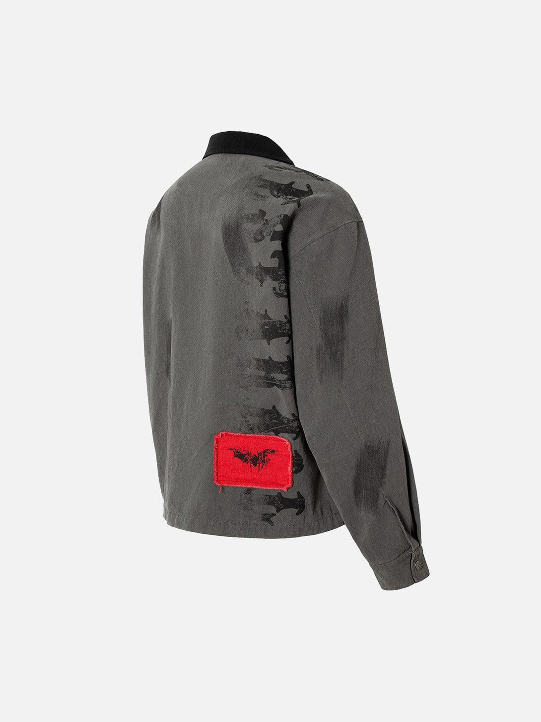 Back view of TALISHKO jacket highlighting black brush strokes and a bold red patch accent.