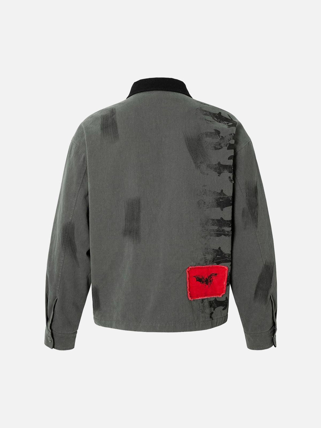 Back view of TALISHKO barn jacket with black brush strokes and red patch detail.