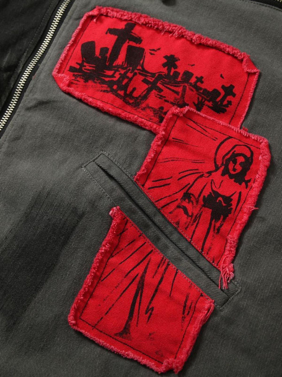 Intricate look at TALISHKO's barn jacket with bold red patches and detailed portrait prints.