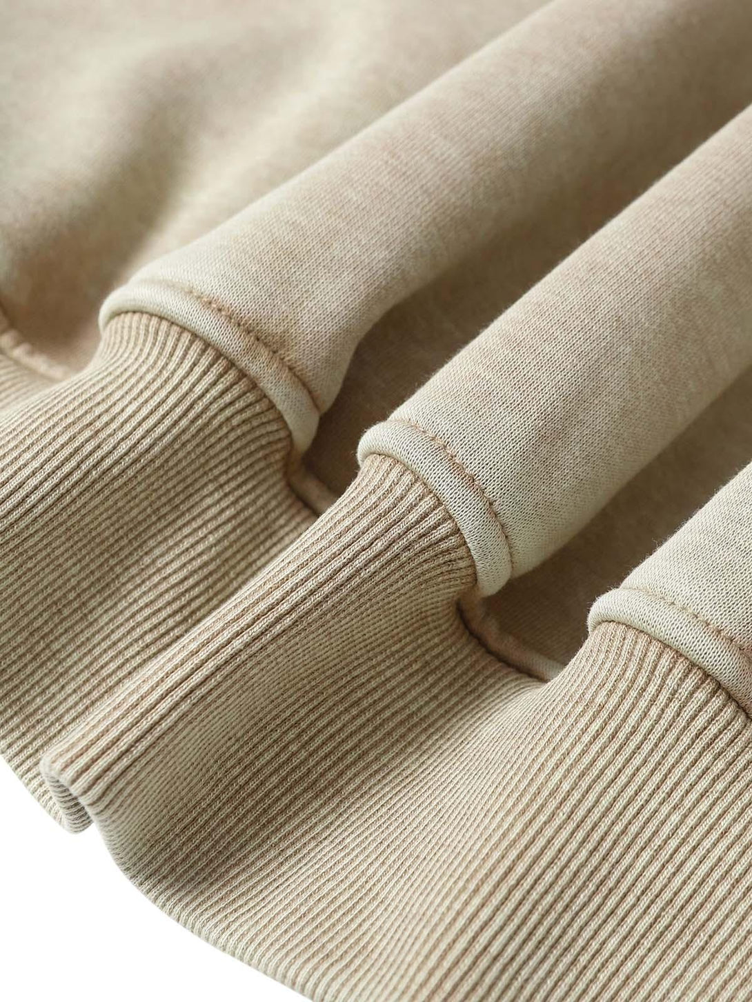 A detailed view of TALISHKO’s washed zipper-up sweatshirt, highlighting its ribbed texture.