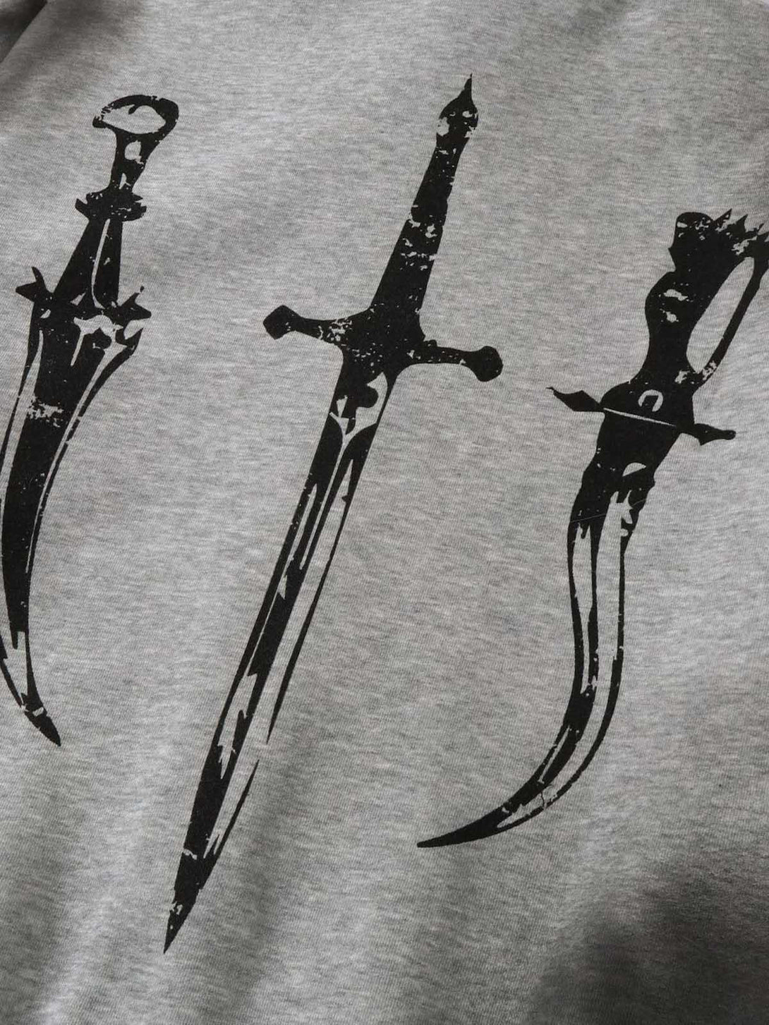 Detailed look at sword graphics on gray Wasteland zip-up cardigan by TALISHKO.