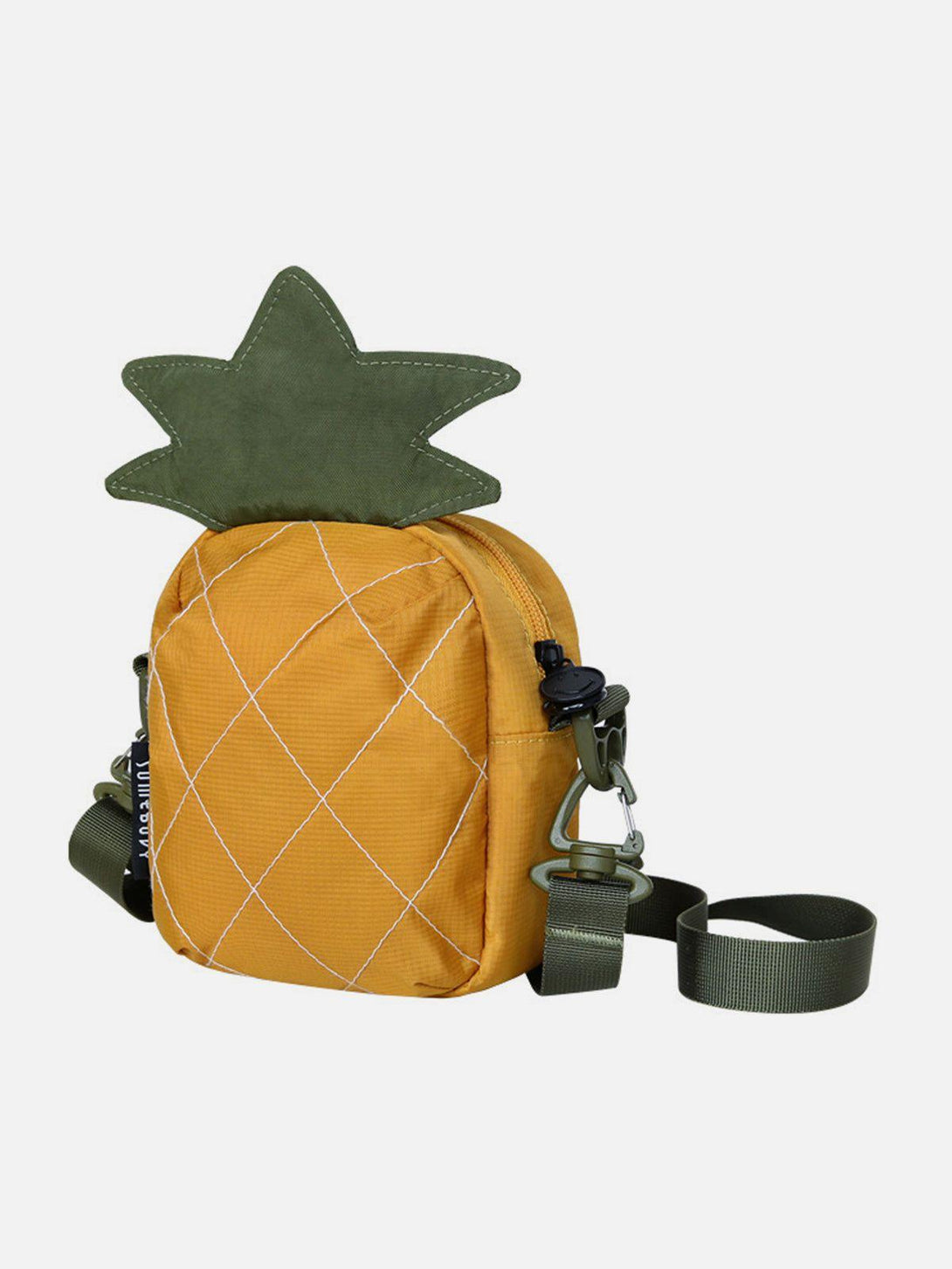 TALISHKO's playful pineapple-inspired bag with a green strap, perfect for adding fun to any look.