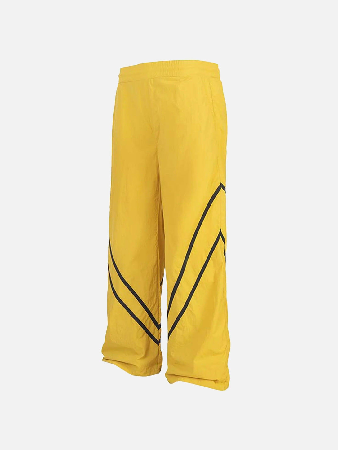 Yellow sweatpants by TALISHKO with black chevron accents, showcasing a relaxed fit.