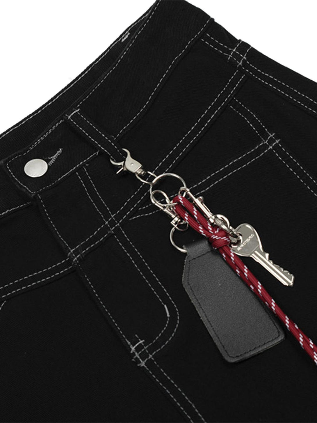 Detailed look at black cargo jorts by TALISHKO, highlighting keychain accessory and stitching.