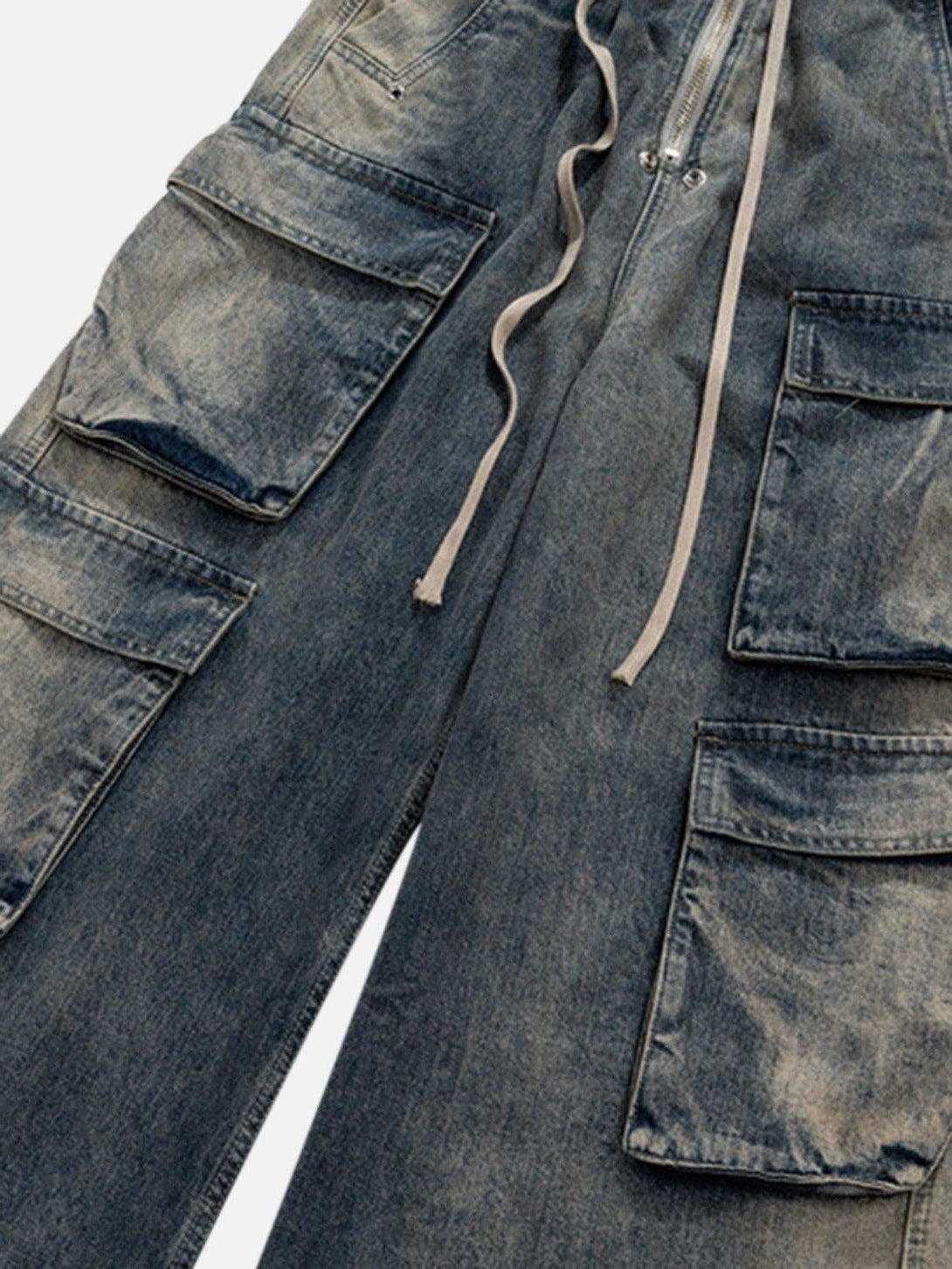 Intricate look at TALISHKO wide-leg jeans featuring multiple pockets and a drawstring detail.