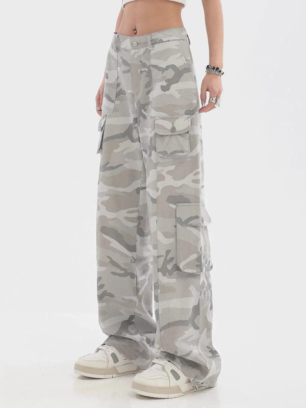 A model wearing TALISHKO wide-leg cargo pants in a stylish camouflage print with pockets.