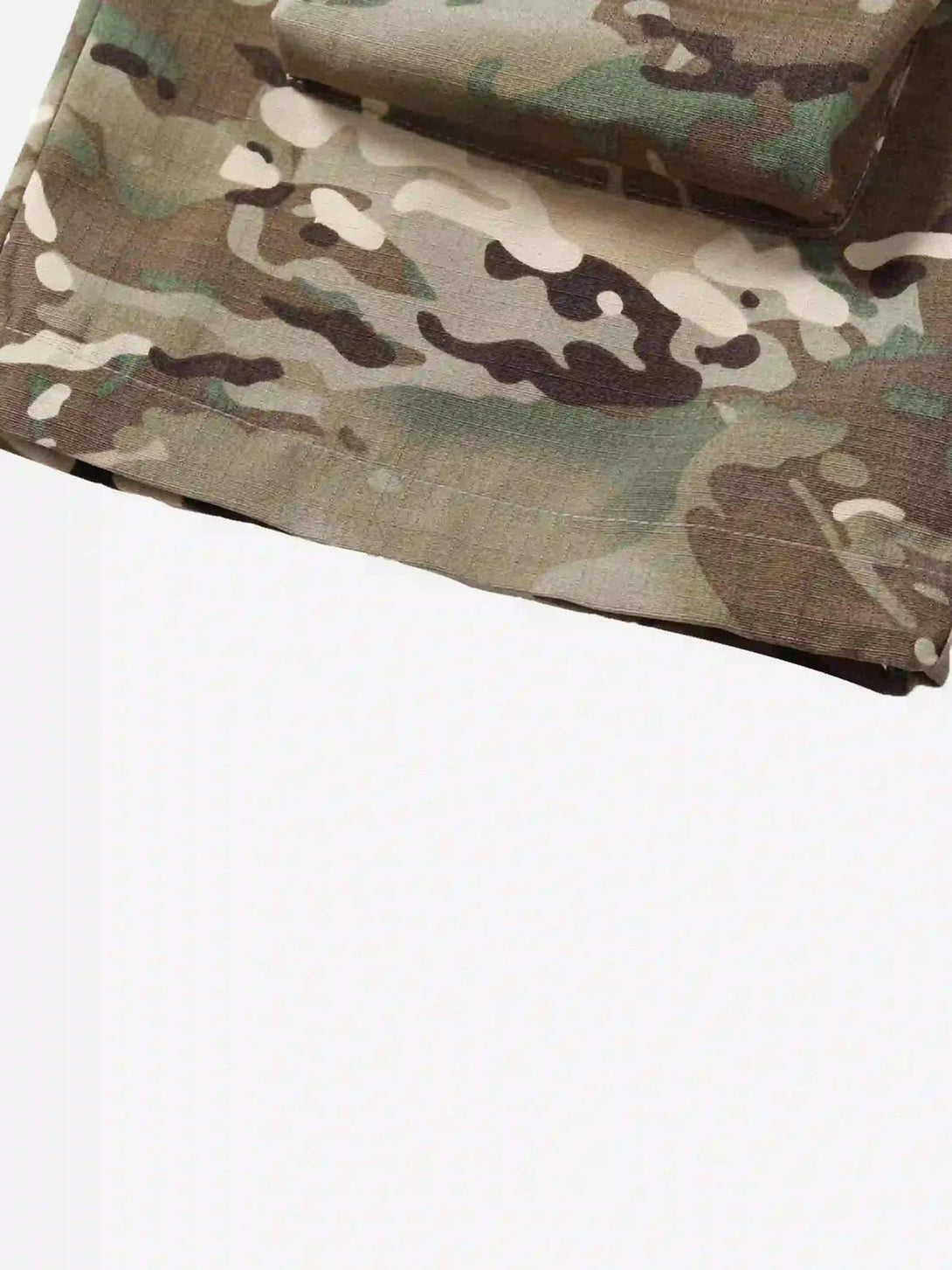 A detailed view of the camouflage pattern on TALISHKO pants, emphasizing street casual style.