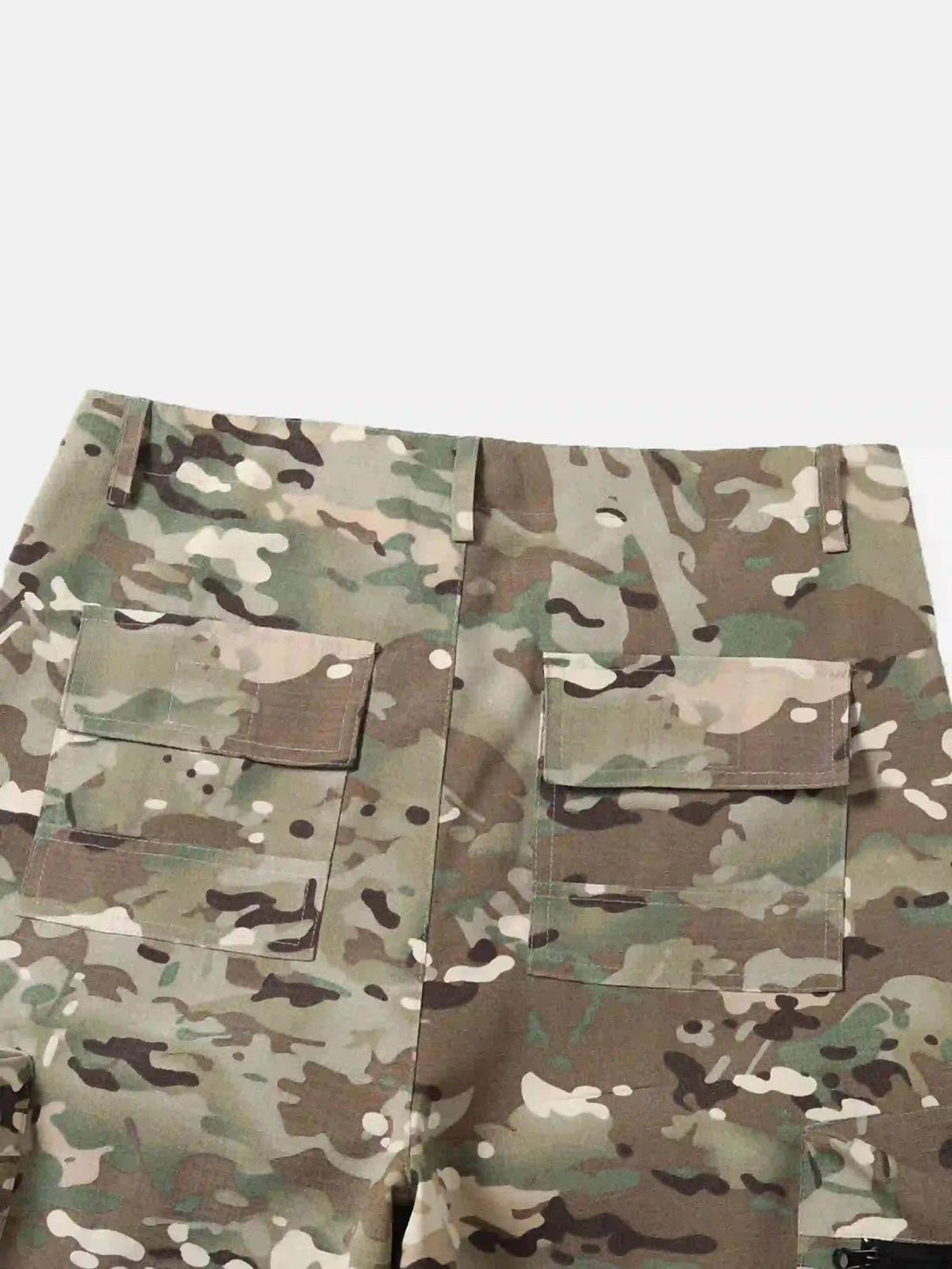 Back pockets of TALISHKO camouflage pants, highlighting street-inspired workwear style.