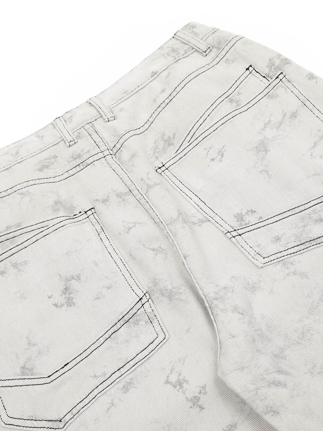 Detailed look at TALISHKO tie-dye workwear pants, highlighting the back pocket stitching.