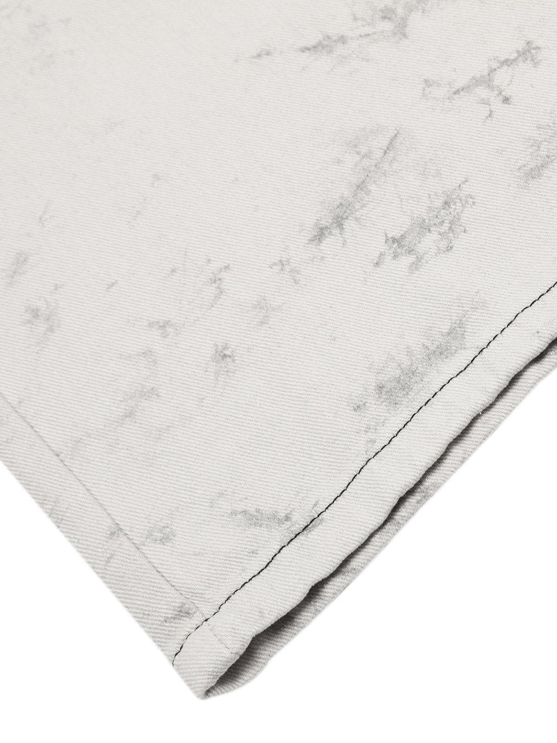 Intricate look at TALISHKO tie-dye workwear pants, highlighting the textured fabric detail.