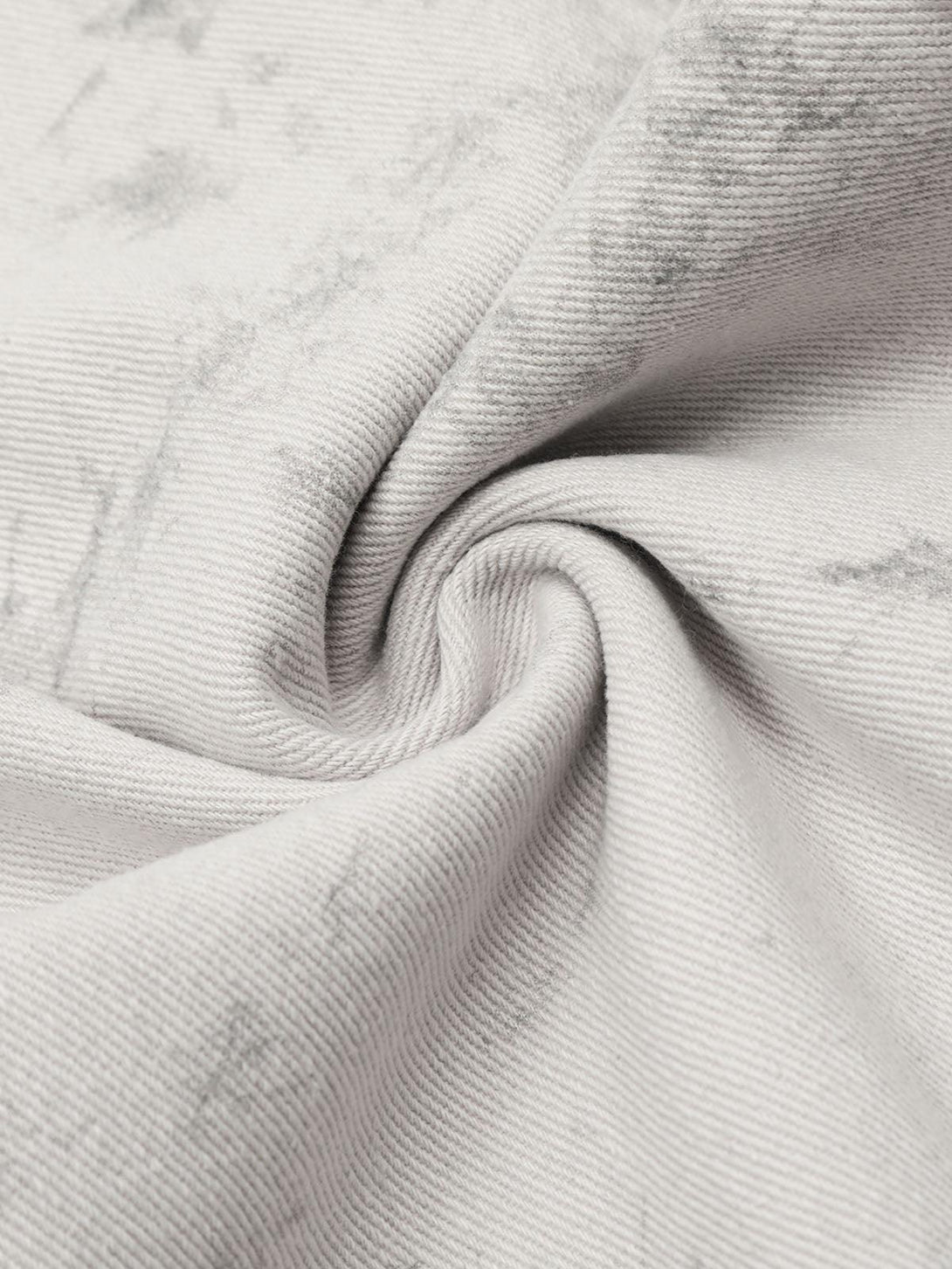 Textured fabric detail of TALISHKO tie-dye workwear pants, showcasing the intricate design.