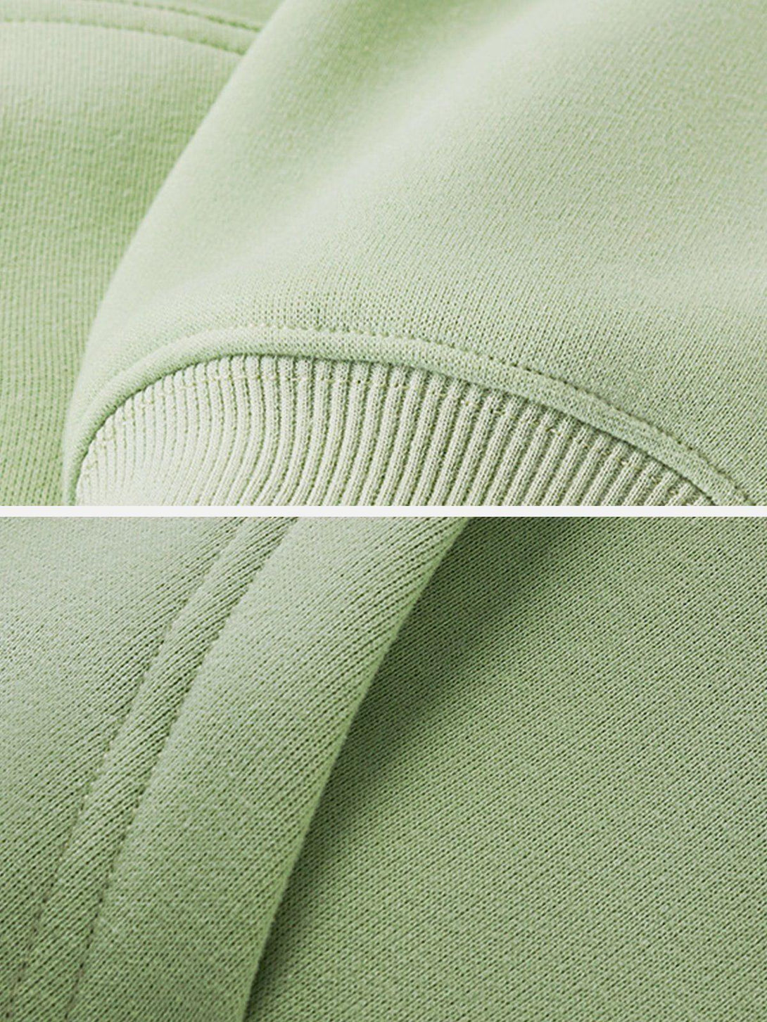 Detailed fabric and stitching of a TALISHKO zip-up hoodie in soft green.