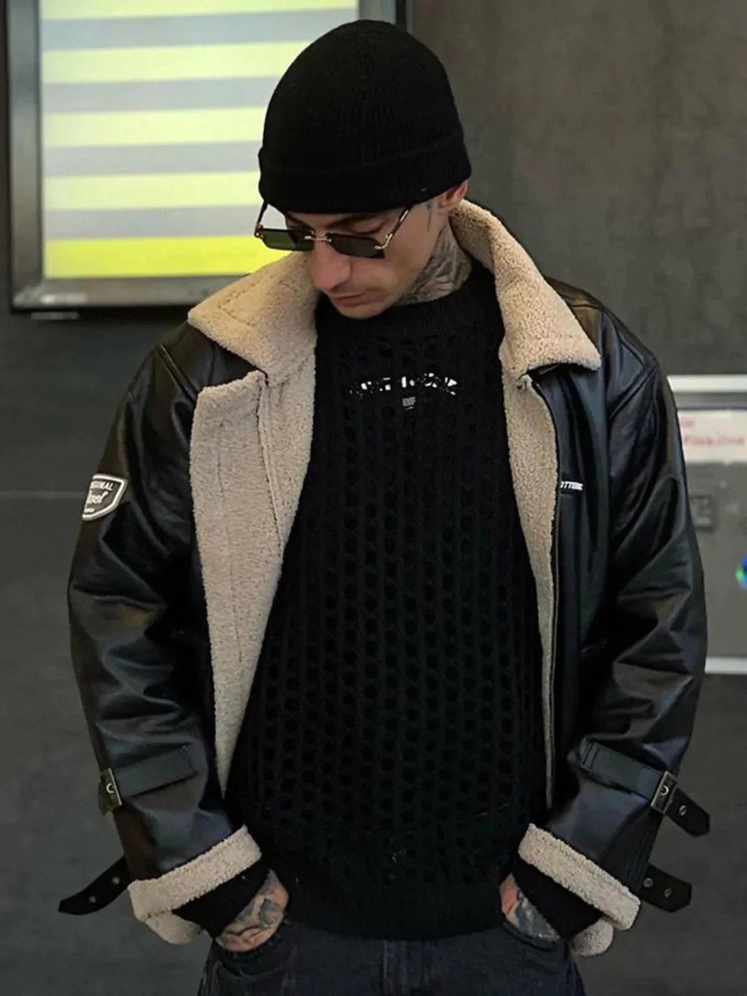 Model wearing TALISHKO PU Borg jacket with beige lining and zipper lapel, paired with black knit.